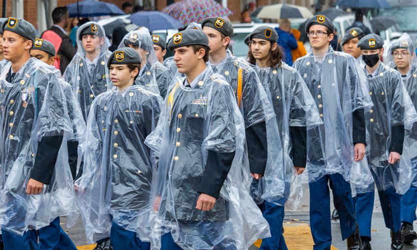 Students march in a Veterans Day Parade